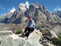 18 Jerome Ryan Poses Above Lake On Baltoro Glacier With Great Trango Tower And Trango Castle Behind